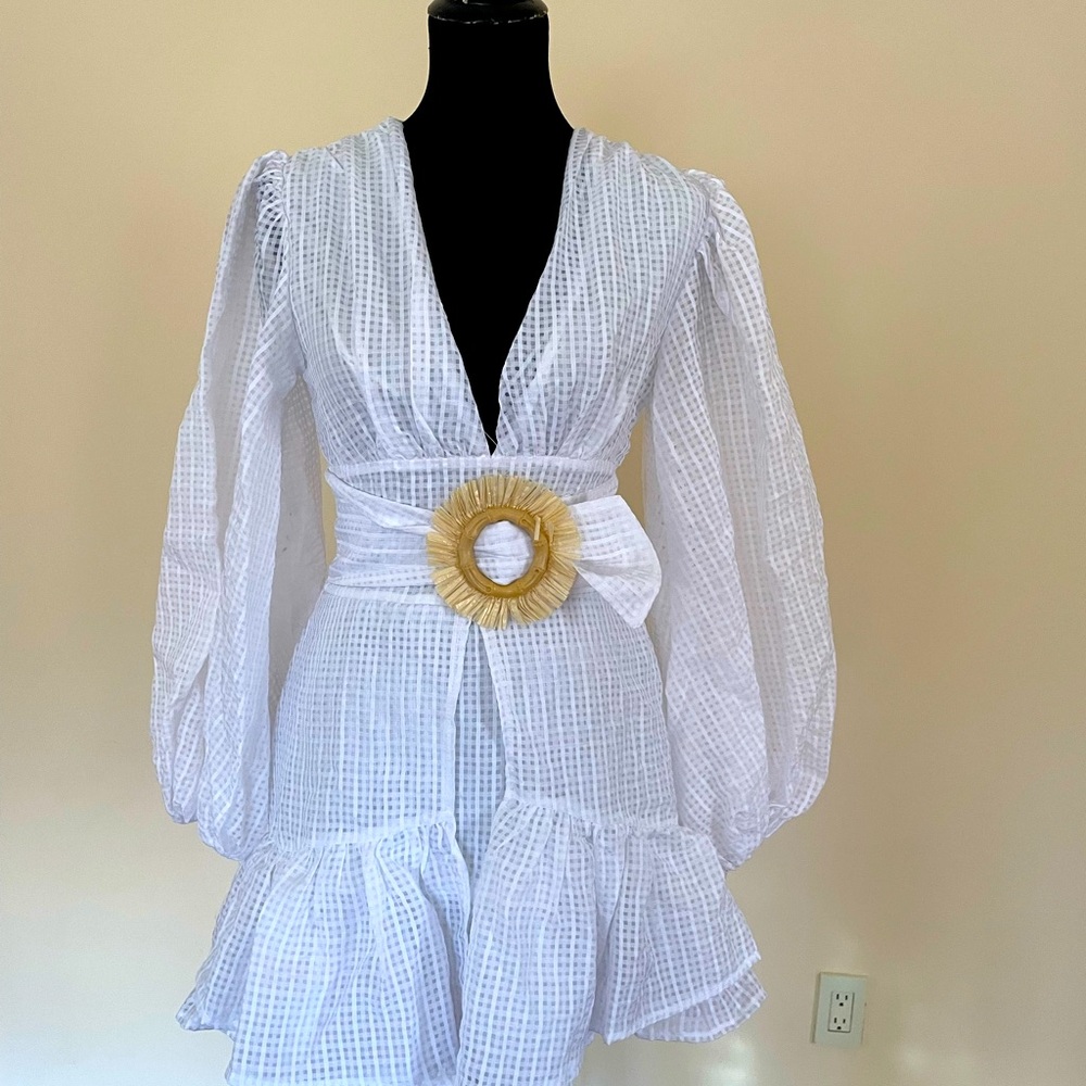 Brand new beautiful white dress with puffy sleeves.